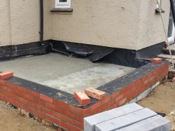 Retaining brick wall with DPC